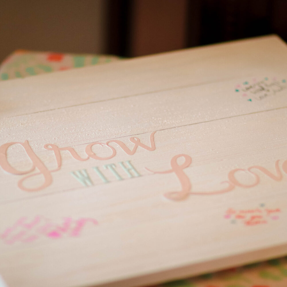 Grow with love sign